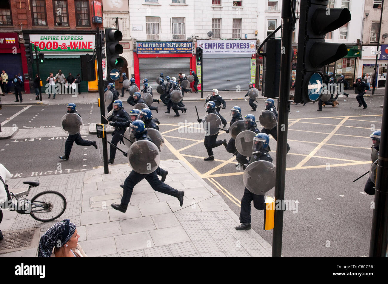 Riot police running down Mare Street, London Riots - Hackney Central - 8/8/2011 Stock Photo