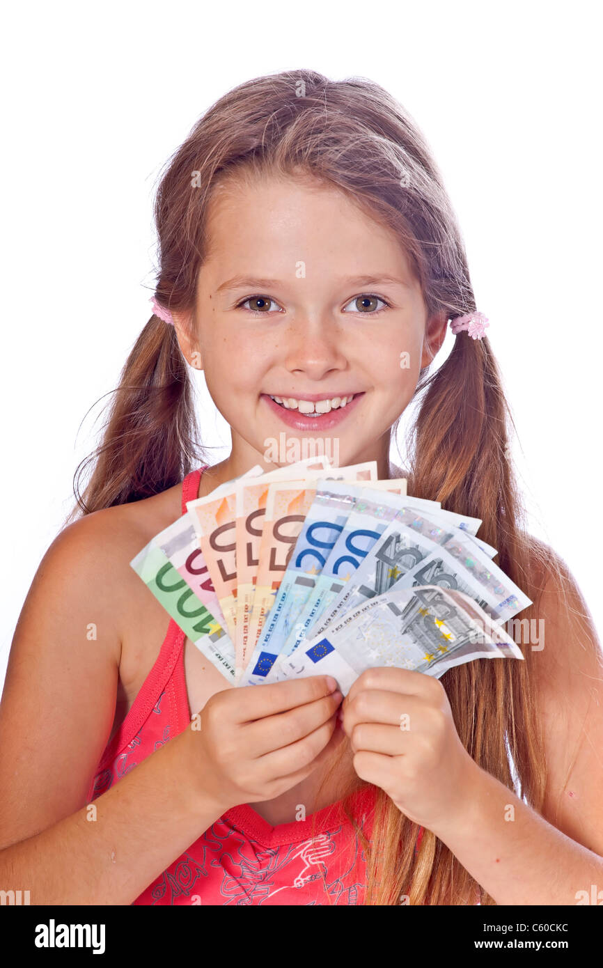 eight year old girl counts her money Stock Photo