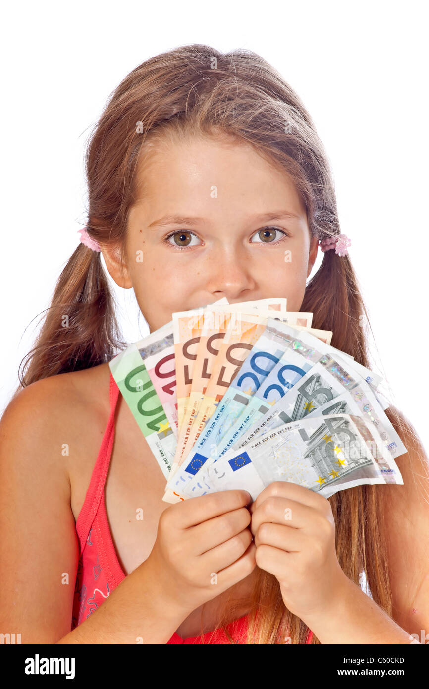 eight year old girl counts her money Stock Photo