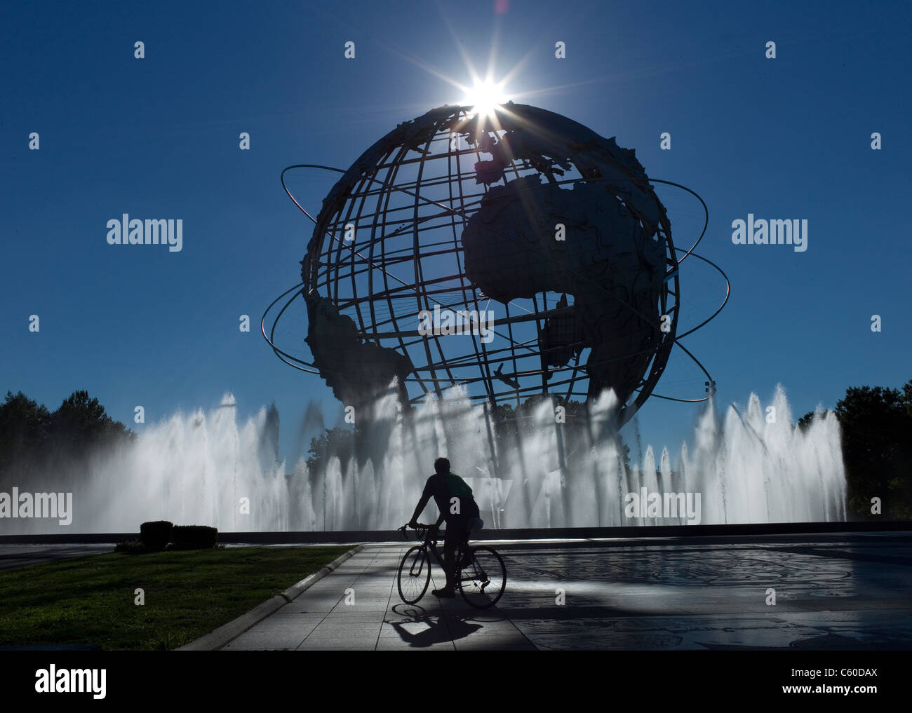 A bicyclist rides near the Unisphere Tuesday, Sept. 14, 2010, in Flushing Meadows, New York. Stock Photo