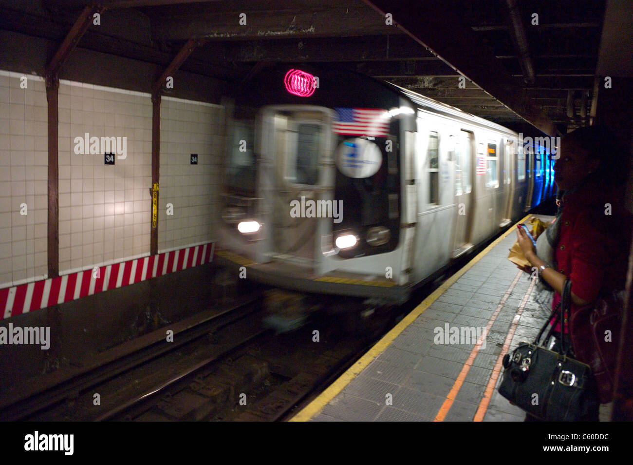 Passengers wait for NY Subway Wednesday, Sept. 15, 2010, in New York. Stock Photo