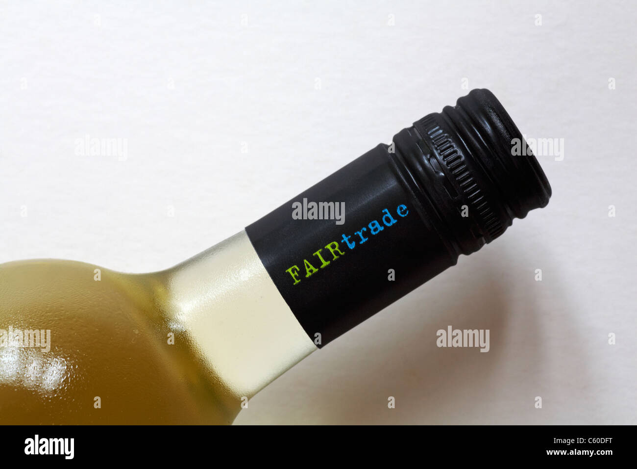 Fairtrade bottle of white wine - close up of screw cap set against white background Stock Photo