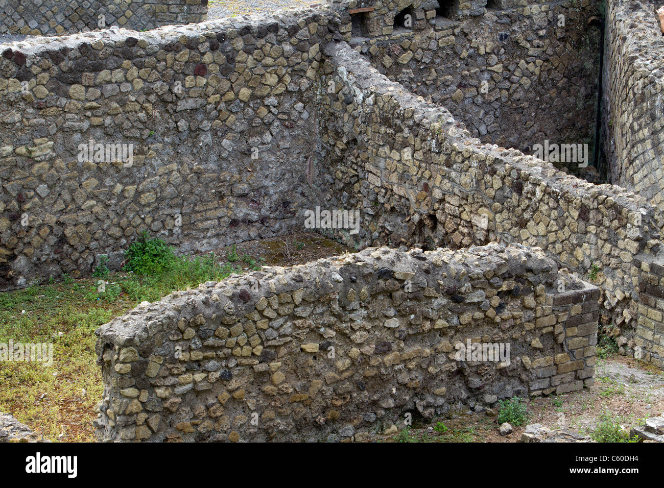Pompeii Italy ruins of ancient city after the destruction by eruption of Mount Vesuvius volcano.  Ruins and rock walls Stock Photo