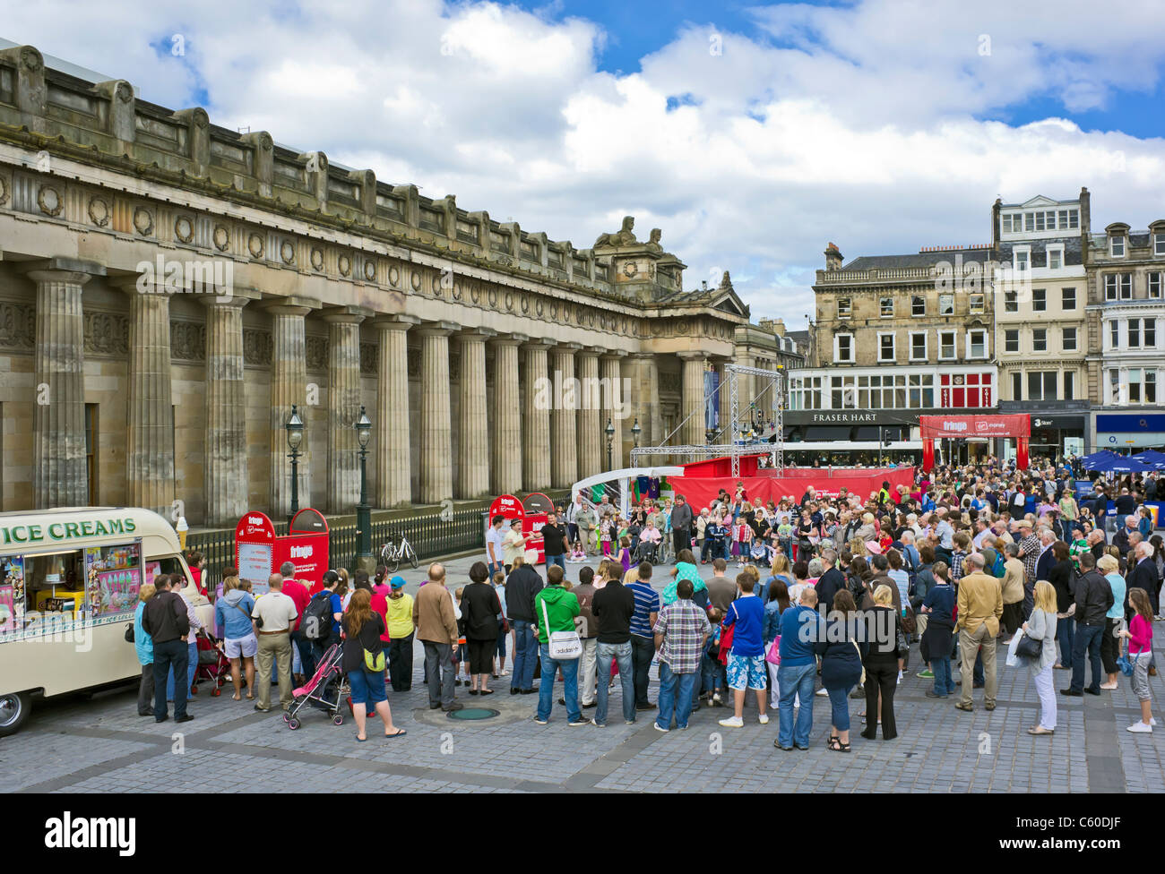 Visitors enjoy a display by artists at the Royal Scottish Academy The Mound Edinburgh during the 2011 Edinburgh Fringe Festival Stock Photo
