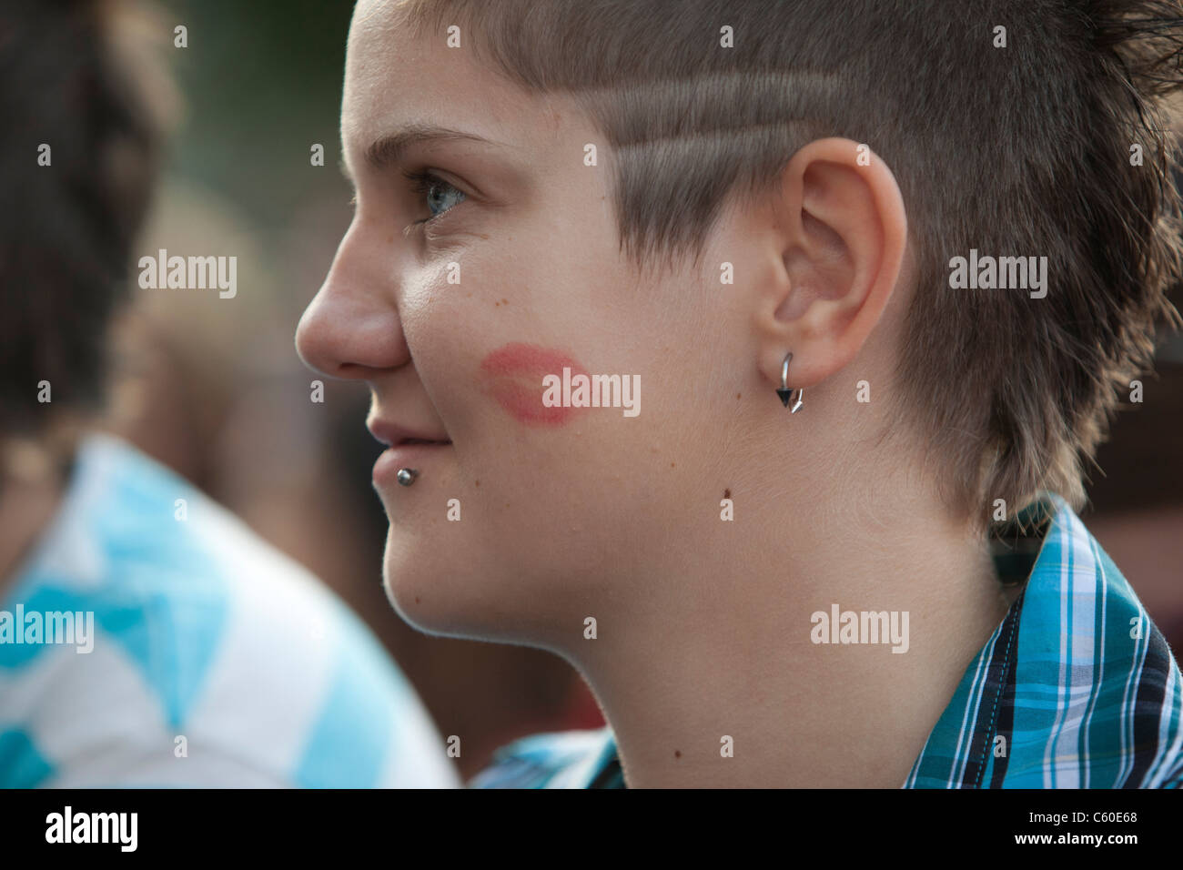 Girl with lipstick kiss on her cheek Stock Photo Alamy