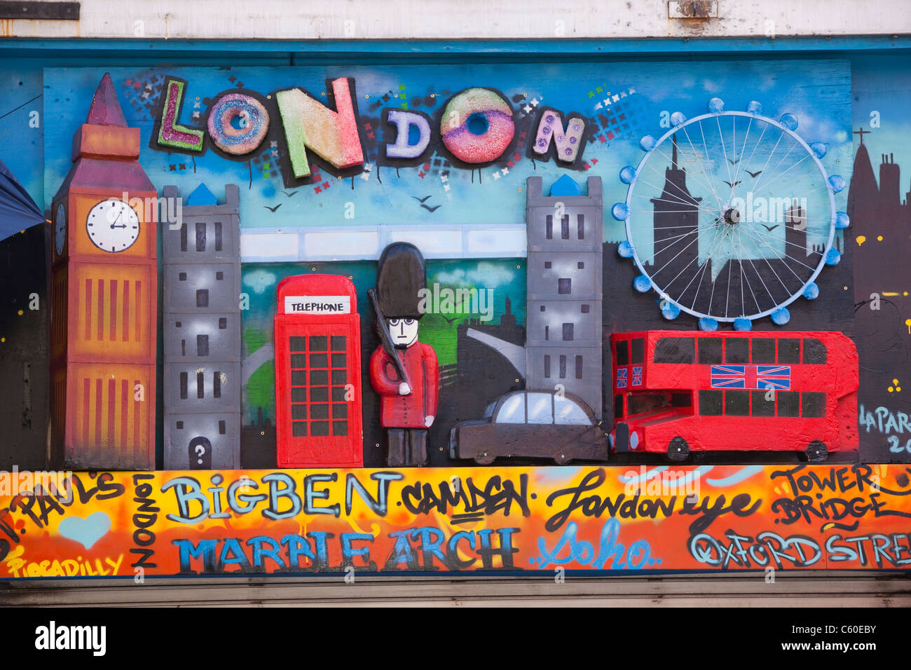 Colourfully decorated facade above shop with London landmarks in Camden ...