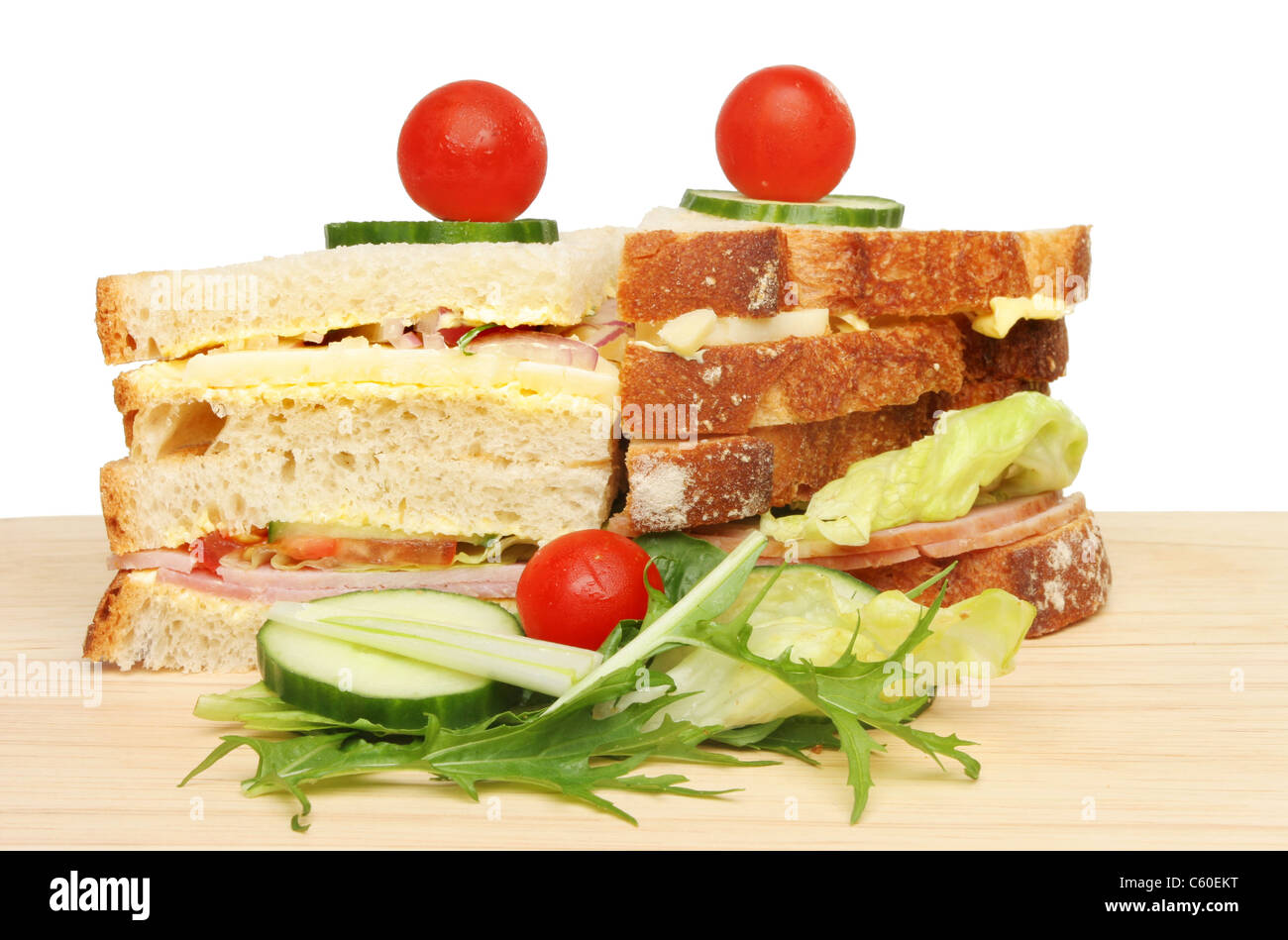 Club sandwich with salad on a wooden board Stock Photo