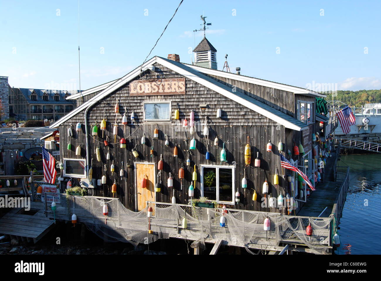 Lobster Shack decorated with colourful buoys - Bar Harbor Maine Stock