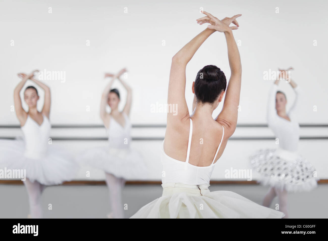 Ballet dancers posing in studio Stock Photo