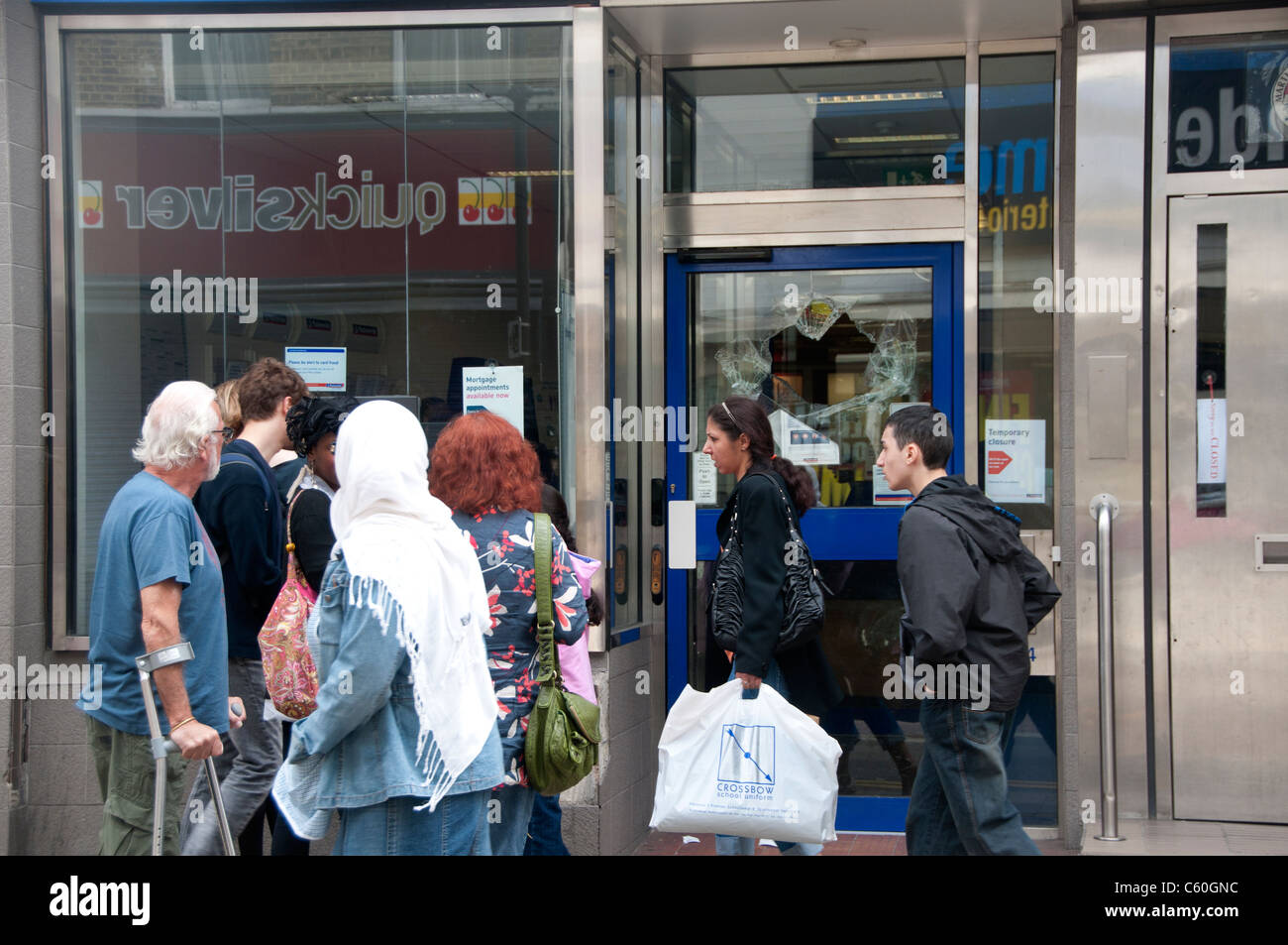 The Narrow Way. Hackney.Broken window of Nationwide Building Society. Stock Photo