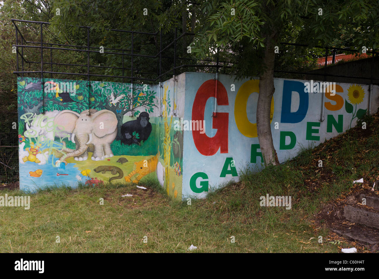 A mural depicting God's garden of Eden on wasteland alongside the river Avon  in central Bristol Stock Photo - Alamy