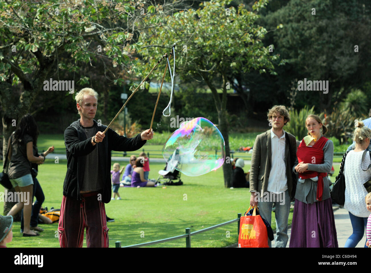 Bubble man in Bournemouth gardens Stock Photo