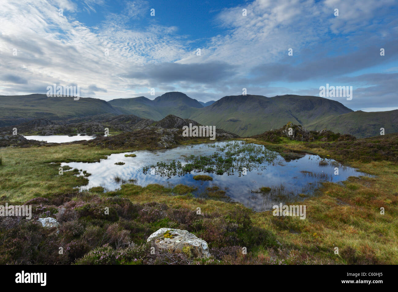 Innominate Tarn on Hay Stacks with Great Gable (centre) and Kirk Fell (right) in the Distance. Lake District. Cumbria. UK Stock Photo