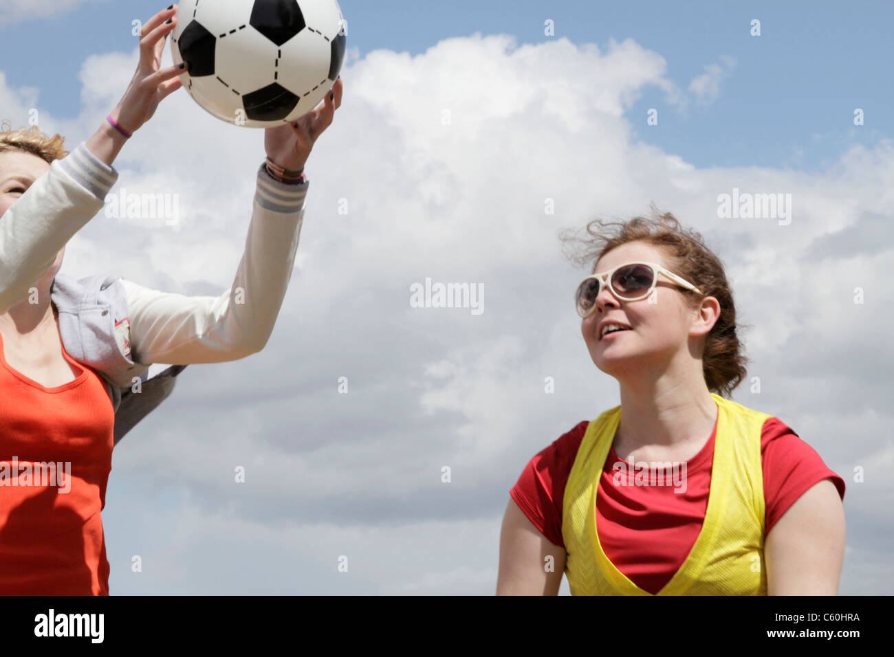 Girls playing soccer together Stock Photo