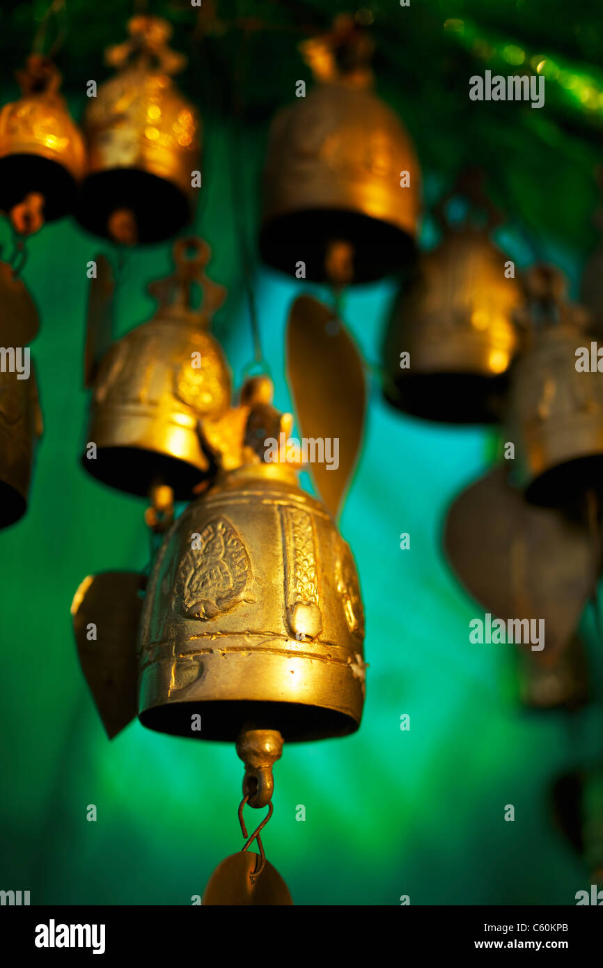 Buddhist bells inside the temple. Vertical shot. Stock Photo