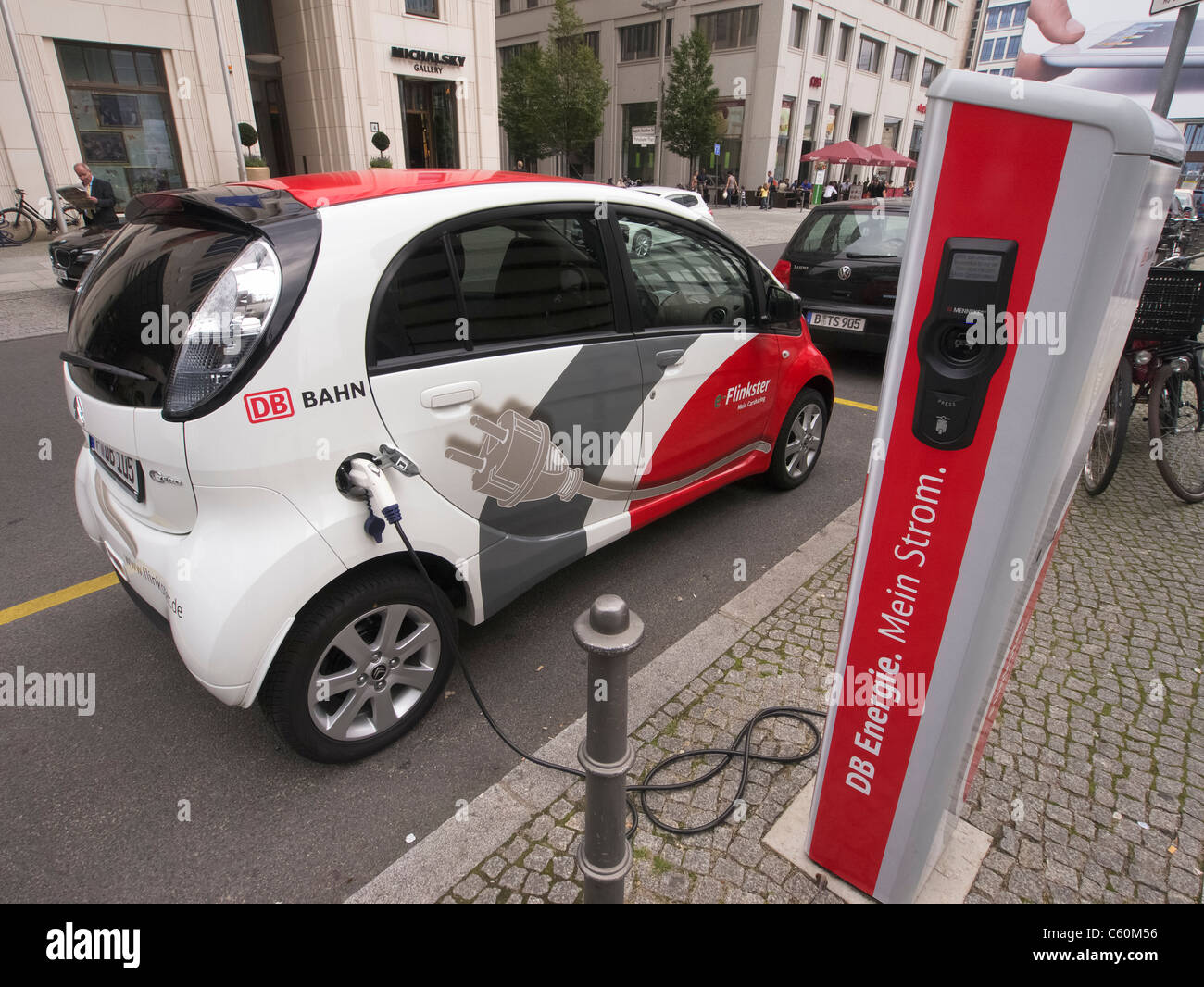 Flinkster DB carsharing electric car being recharged on street in Berlin German Stock Photo