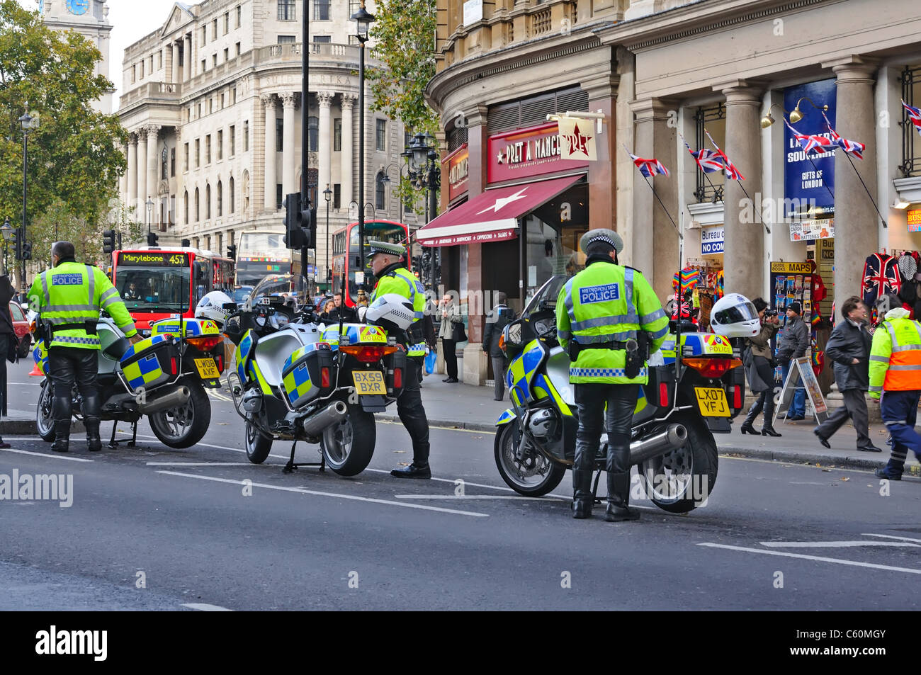London policemans on motorcycles, law and order control. Not far from Trafalgar Square, Whitehall on the street. London UK Stock Photo