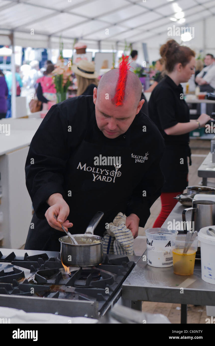 Chef from Belfast's Molly's Yard restaurant cooking in a marquee Stock Photo