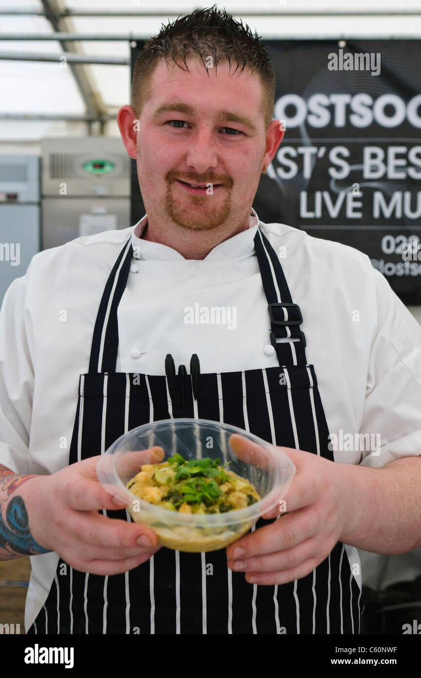Gerard McQuillan, chef from Belfast's Lost Society with his Thai Curried Fish Noodles at Belfast Tastefest food festival Stock Photo