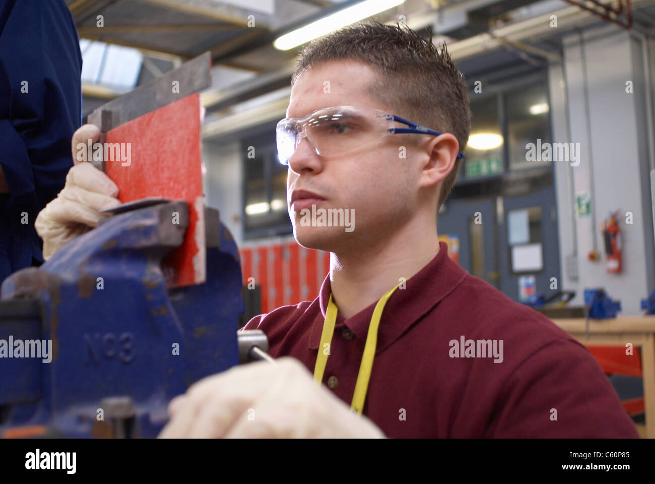 Worker measuring plastic in factory Stock Photo Alamy