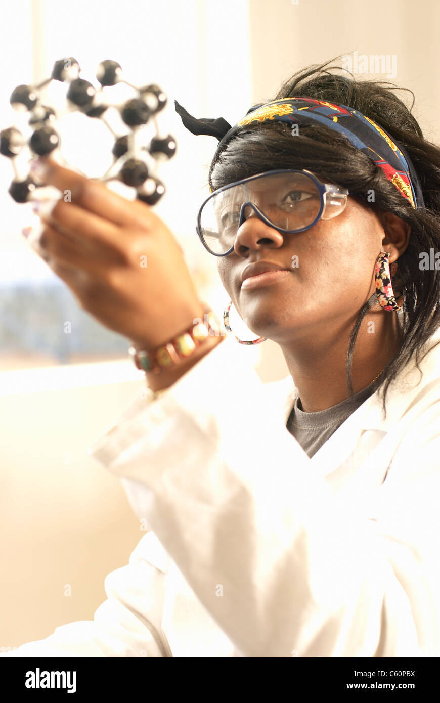 Scientist examining molecular model Stock Photo