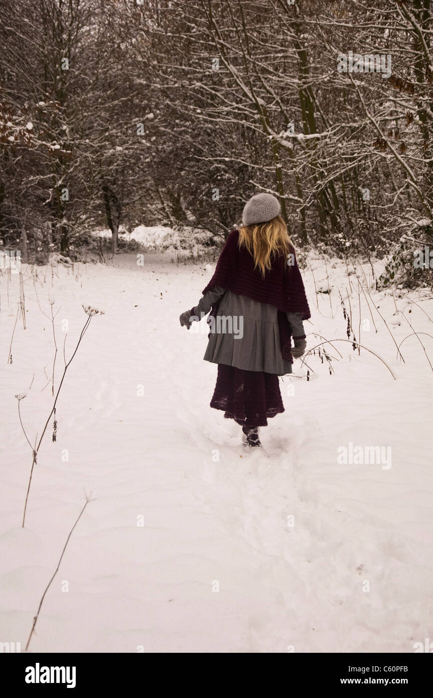 Lady walking in snow hi-res stock photography and images - Alamy