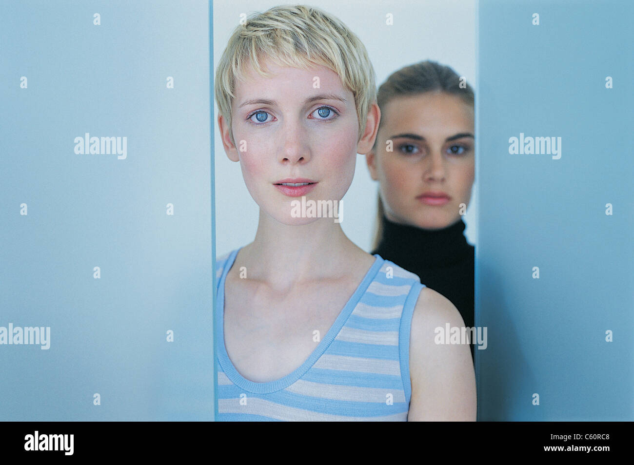 Two women standing together hi-res stock photography and images - Alamy
