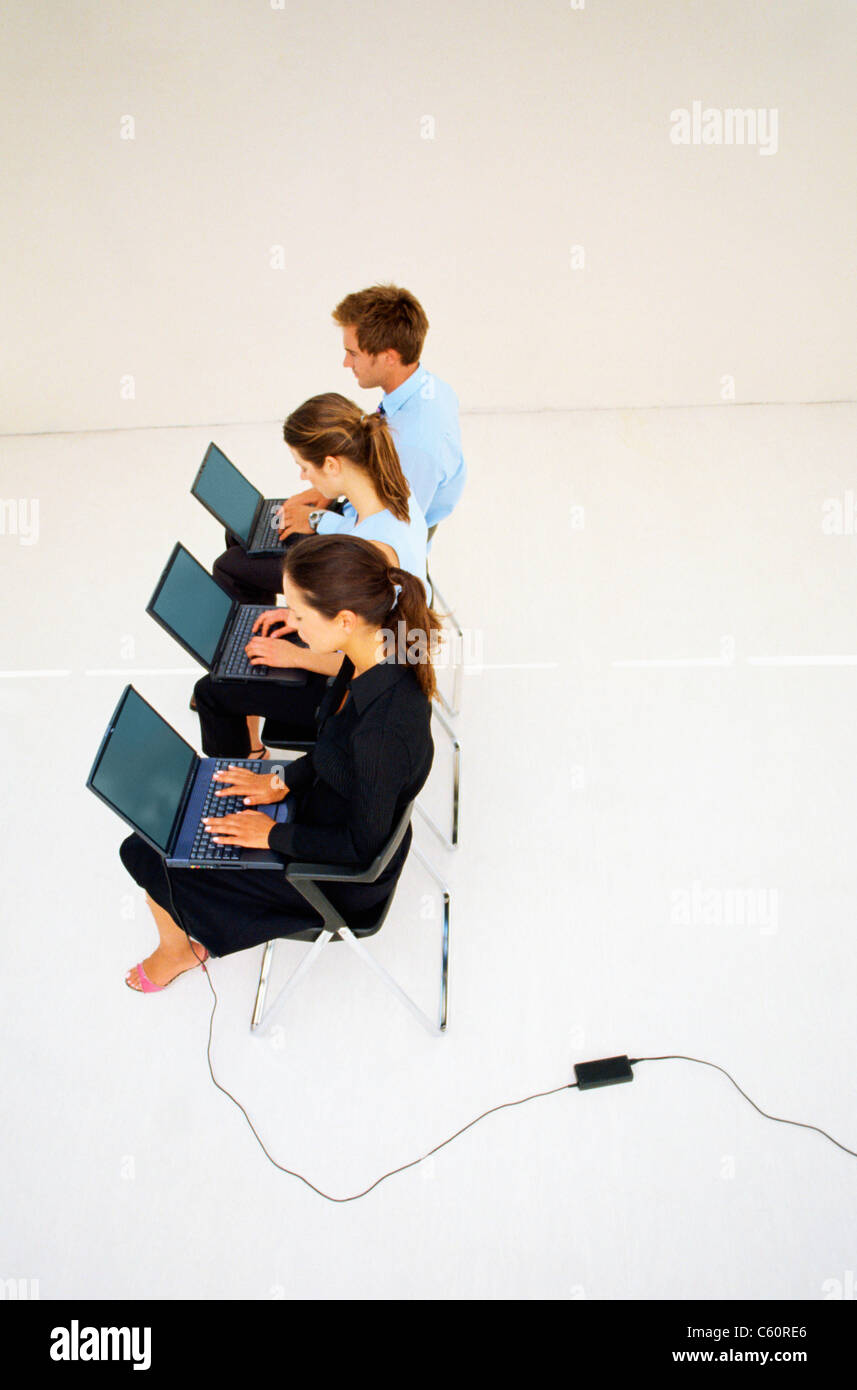 Business people using laptops in office Stock Photo - Alamy