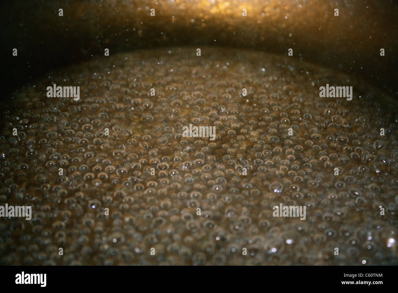 Close up of water boiling in a saucepan Stock Photo