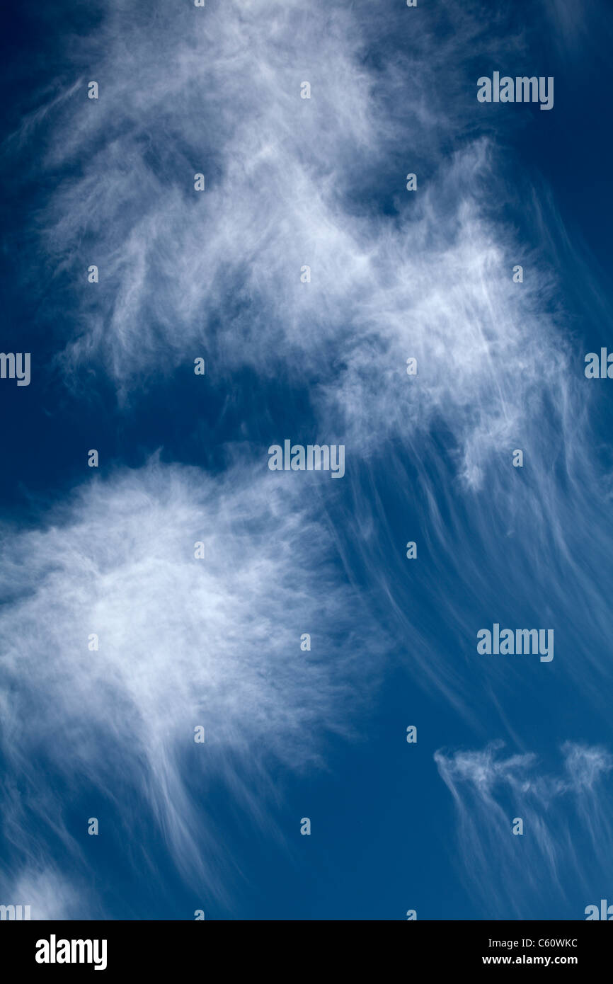 Cottony patches of cirrus clouds. Stock Photo