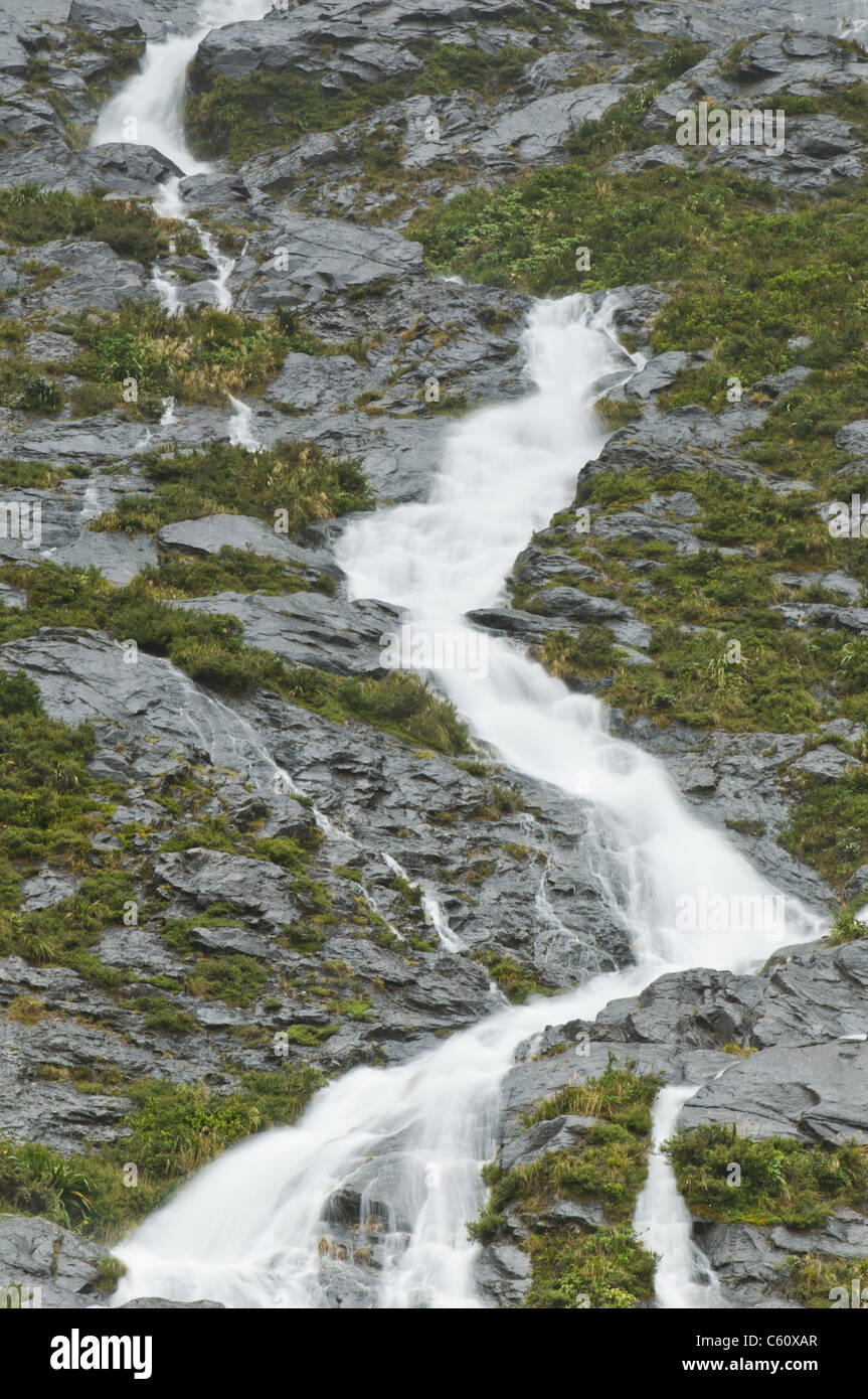 Waterfall during rain showers from a under normal case dry mountain ...