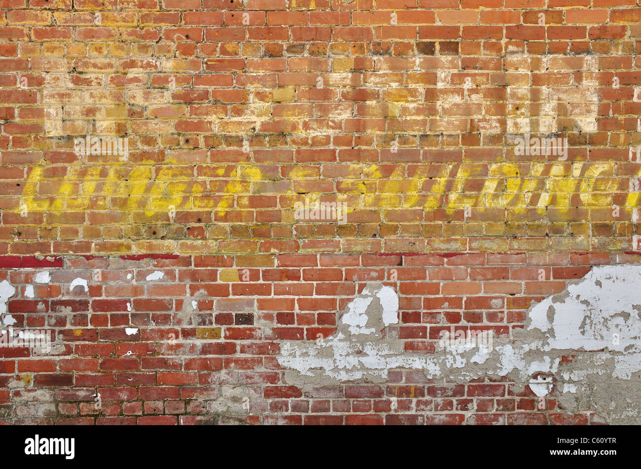 Texture and writing on old brick wall in historic downtown Fernandina