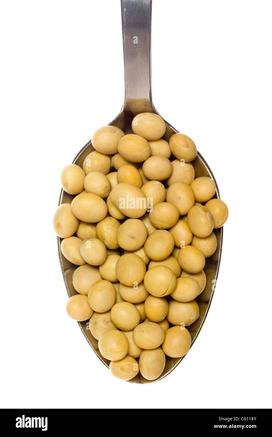 Spoonful of soy beans isolated on white background Stock Photo