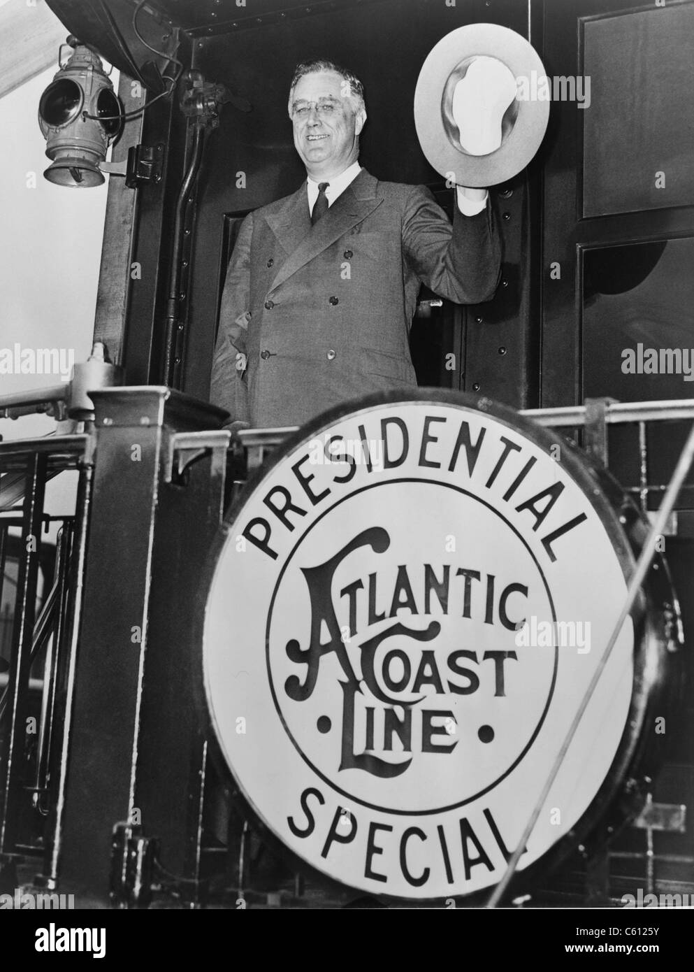 President Franklin D. Roosevelt, leaving Washington, D.C. for Florida, waving goodbye from the rear of the Atlantic Coast Line Presidential Special Railroad. 1934. Stock Photo