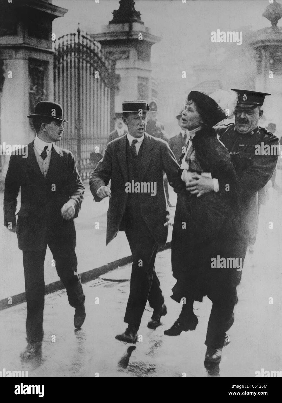 British suffragette Emmeline Pankhurst arrested and carried away by a policeman for leading suffragettes attempt to present a petition to King George V at Buckingham Palace. June 2, 1914. Stock Photo