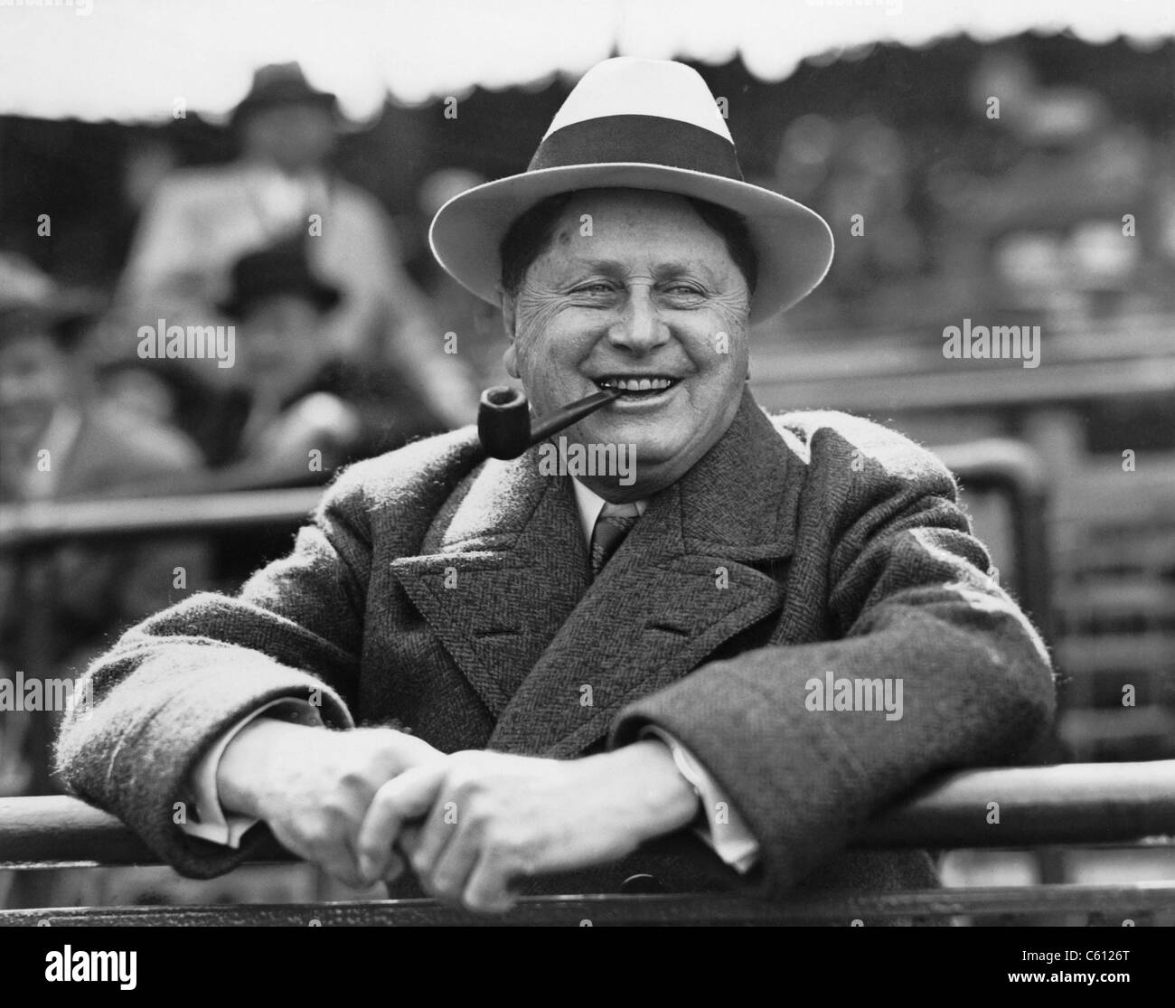 William Wrigley, (1861-1932), president of chewing gum company, watching a game between his Chicago Cubs and the St. Louis Cardinals, in Chicago, Illinois. Ca. 1925. Stock Photo