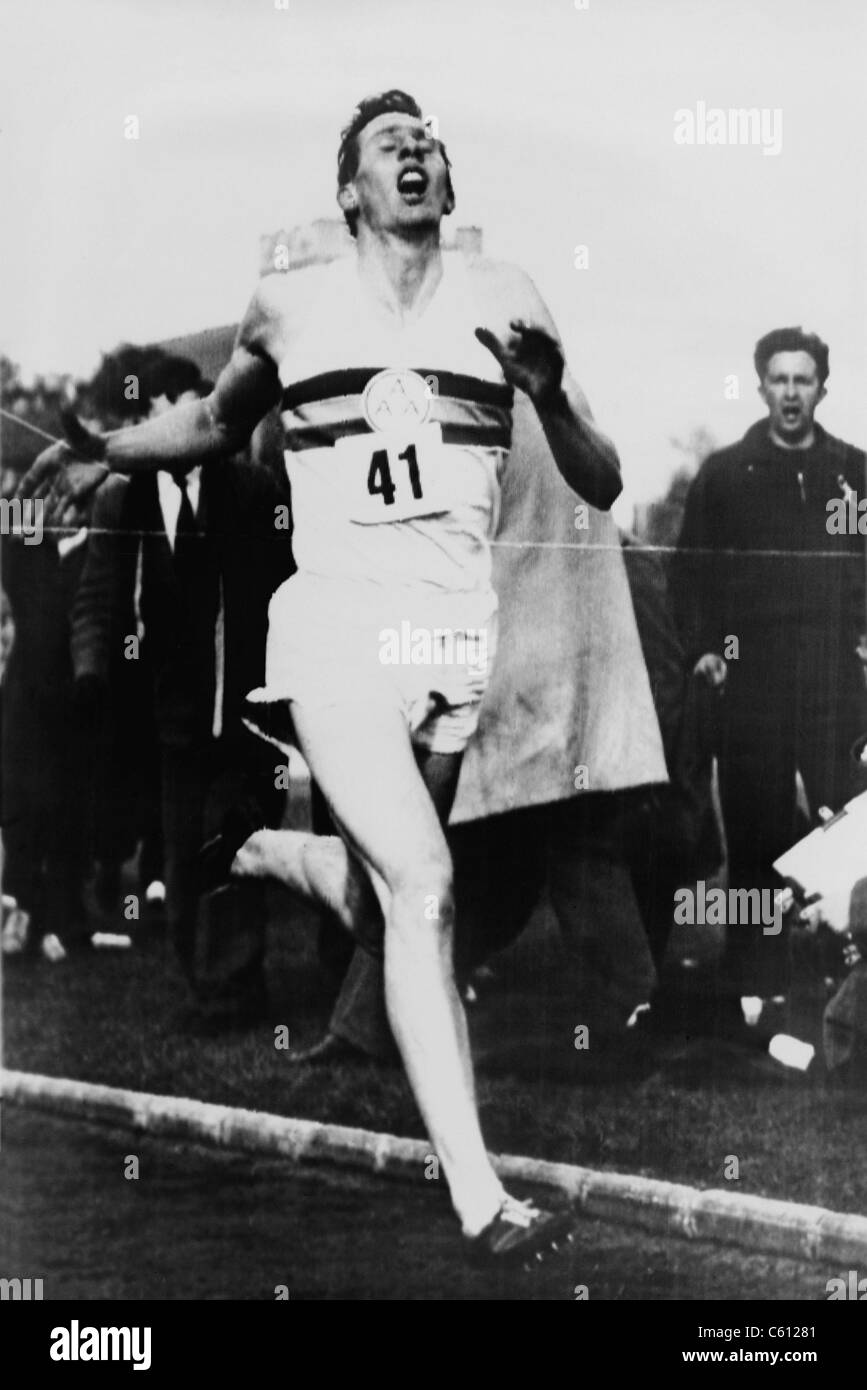 Roger Bannister crossing the finish line in three minutes and 59.4 seconds, achieving the four-minute mile, Oxford, England on May 6, 1954. Stock Photo