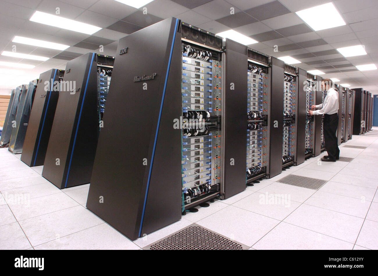 Computer scientist at Argonne National Laboratory inspects the new IBM Blue Gene/P supercomputer, recently named the fastest computer for open science in the world. 2009. Stock Photo