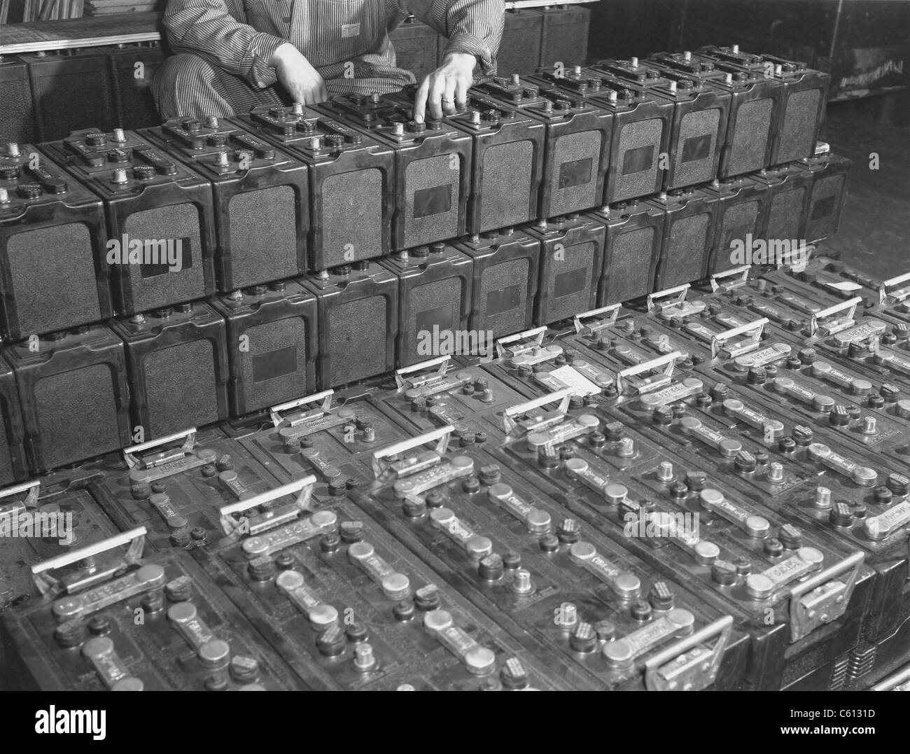 Dozens of 12 volt rechargeable automobile batteries at a the White Motor Company, Cleveland, Ohio. 1941. Stock Photo