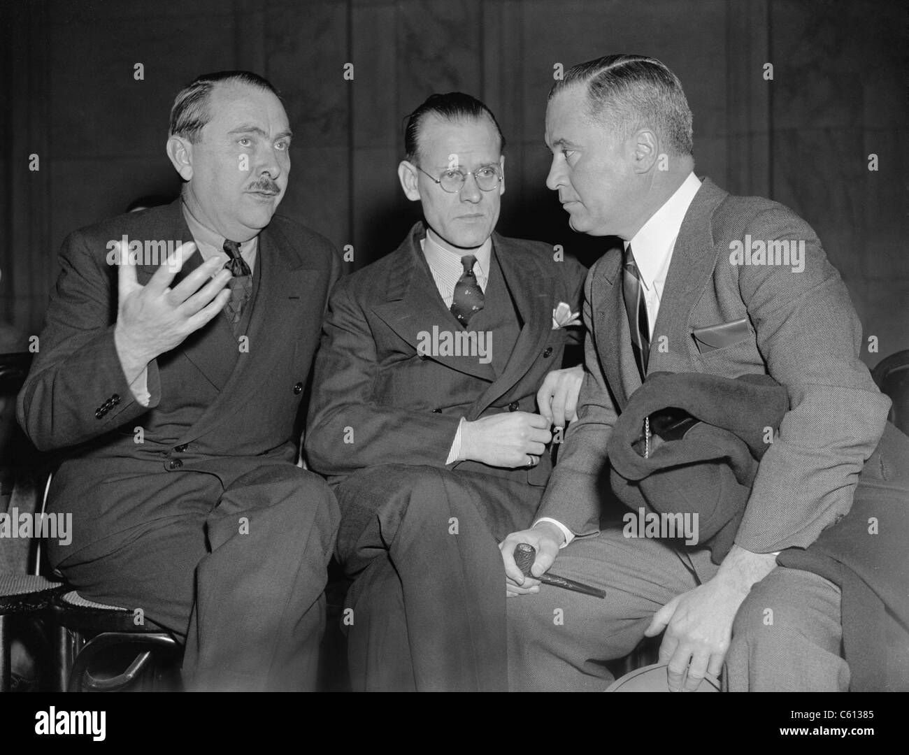 American television inventor, Philo T. Farnsworth testified to a Congressional committee about the difficulties in getting patents. Farnsworth is seated between George Everson, Secretary of Farnsworth Television, Inc. and Richard C. Patterson, Jr., Assistant Secretary of Commerce. January 1939. Stock Photo