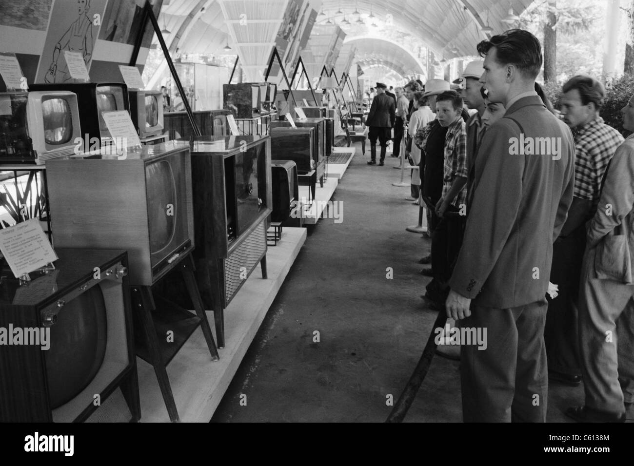 Russians looking at television sets at the American National Exhibition at Sokolniki Park in Moscow on August 5, 1959. A few day earlier the exhibition had been the site of the famous Nixon-Khrushchev kitchen debate. Stock Photo