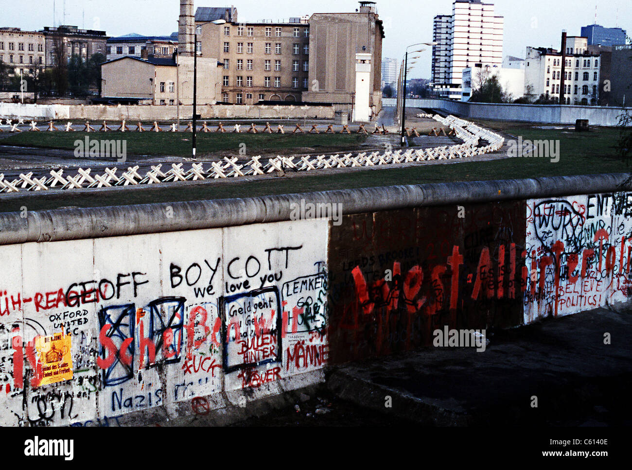 The Berlin Wall separated Communist-controlled East Germany from West Berlin. White apartments of West Berlin contrast with the Stock Photo