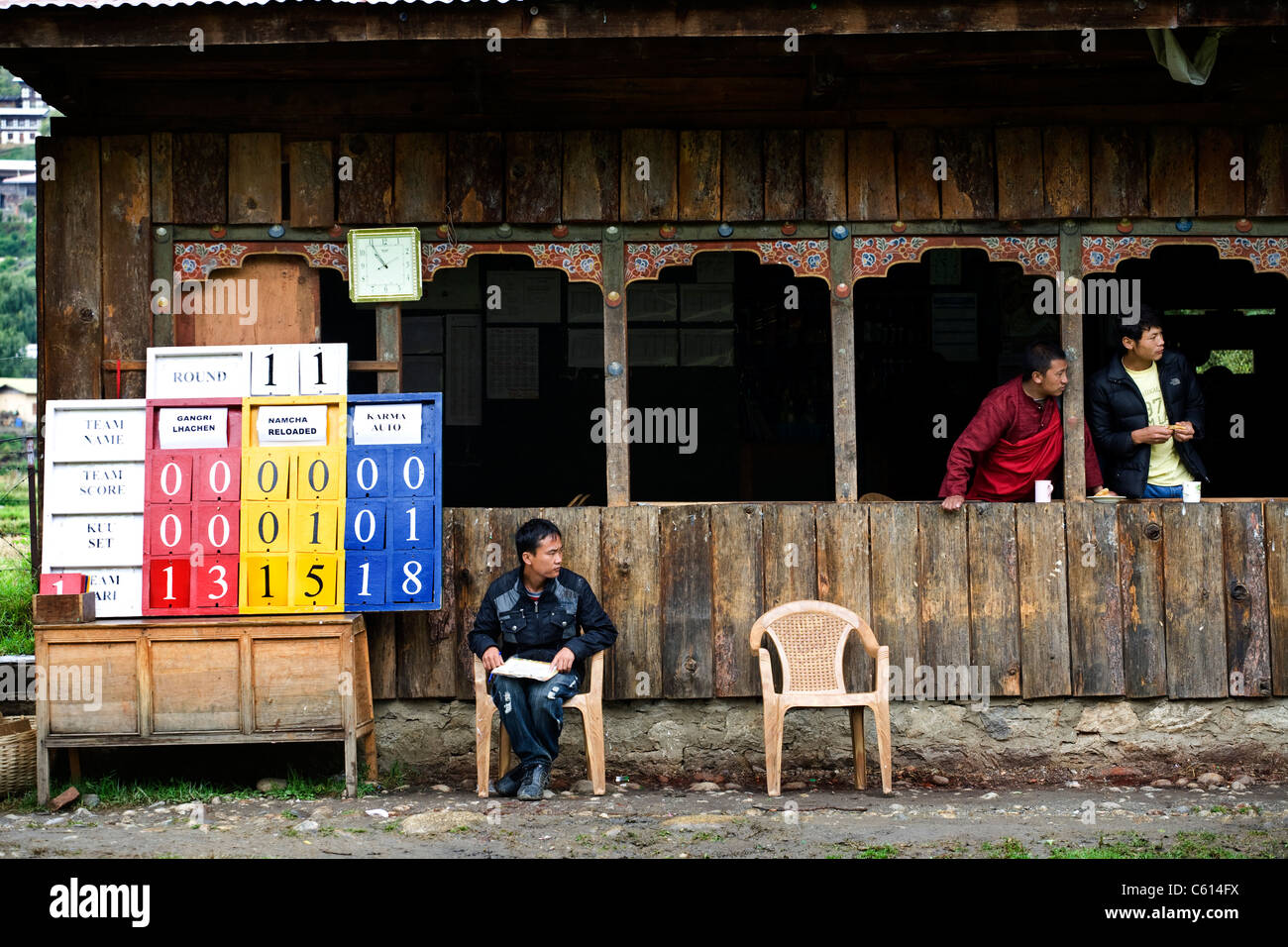 Bhutanese monk along with his friend watching Archery game. Paro. Bhutan Stock Photo