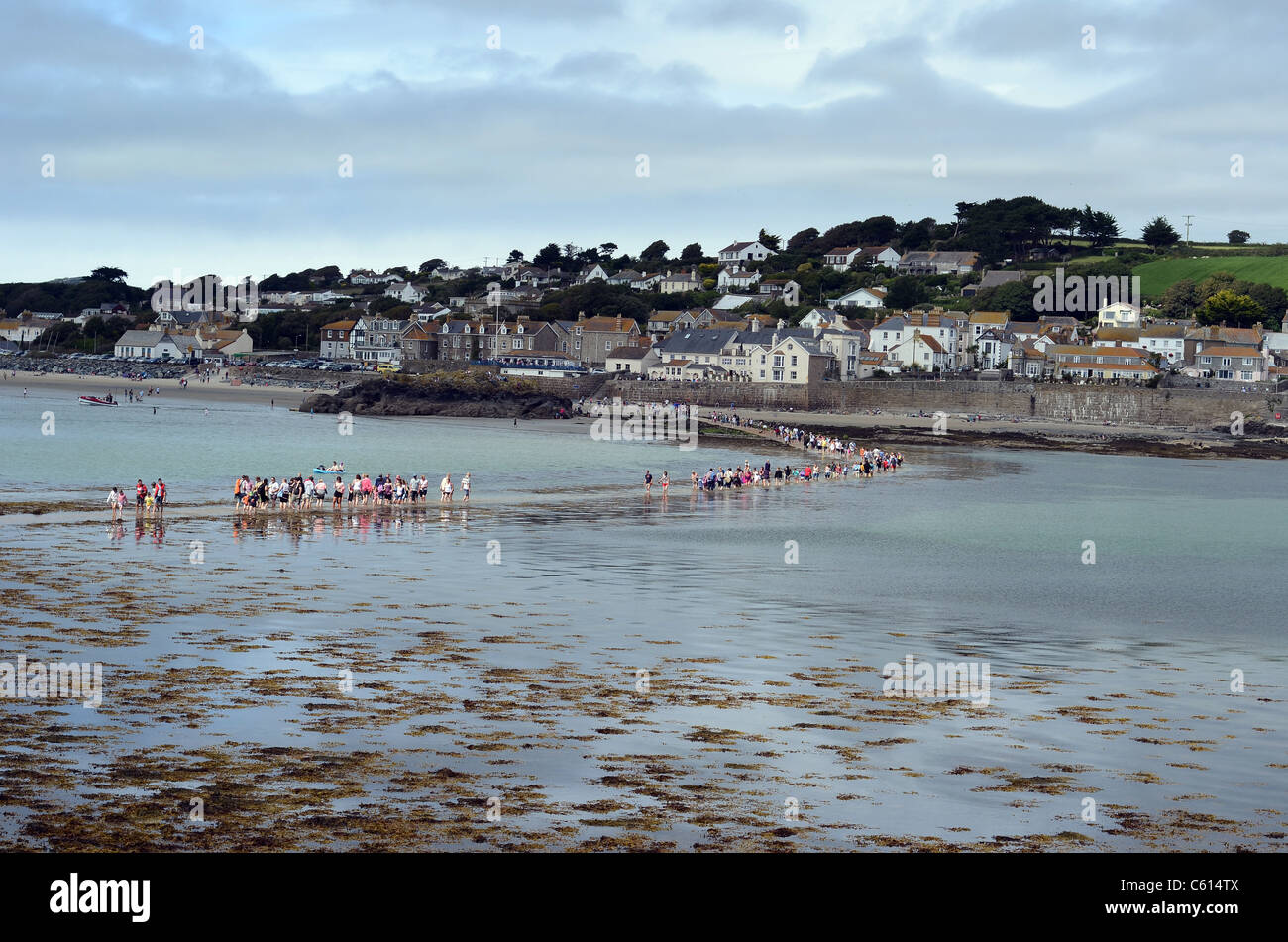 People crossing the sea at low tide to marazion from St Michael's Mount  Stock Photo - Alamy