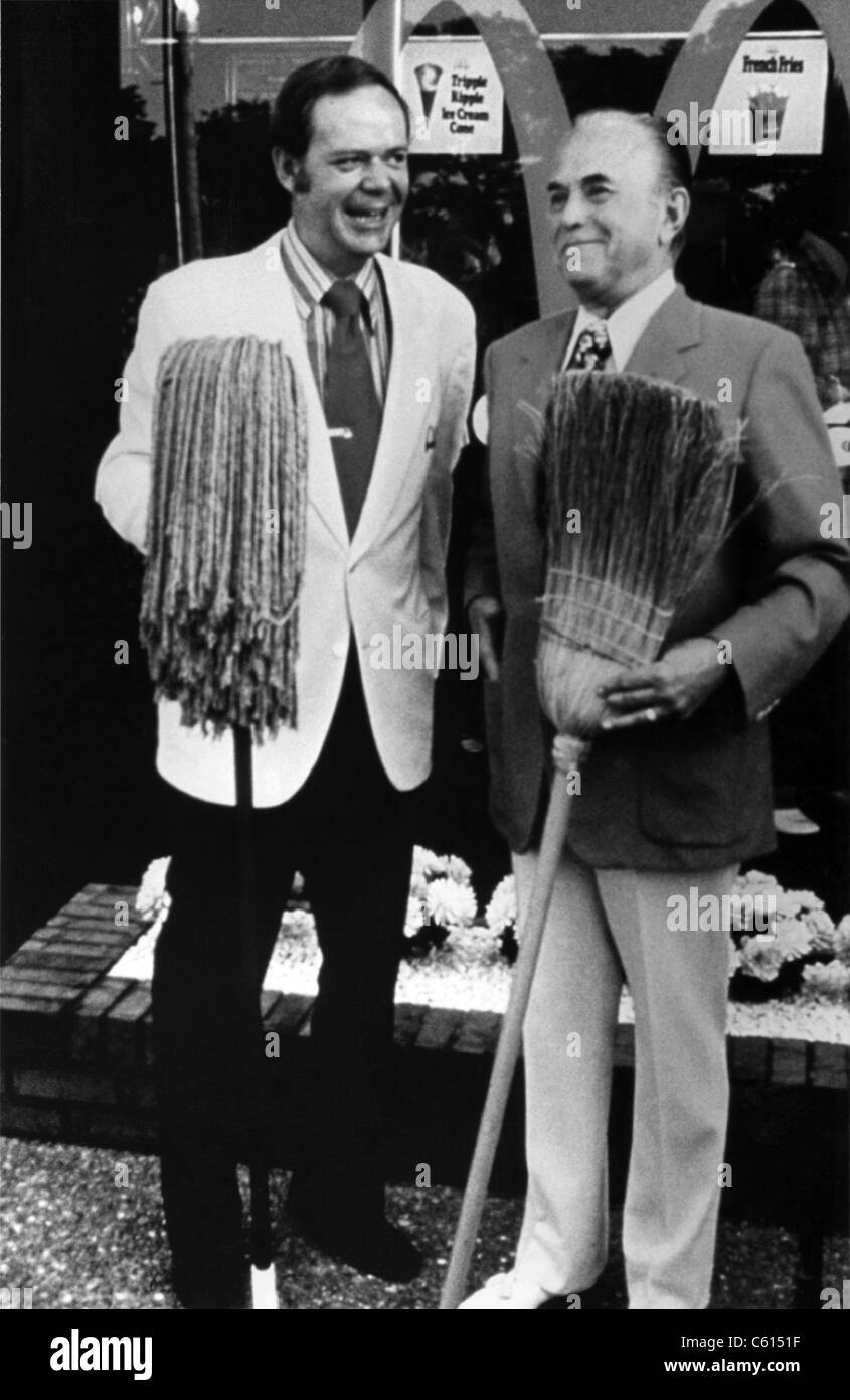 Fred Turner with mop and Roy Kroc with broom at the 2500th McDonald's franchise restaurants at Hickory Hills Illinois in 1973. McDonald's Corp. photo., Photo by:Everett Collection(BSLOC 2011 6 175) Stock Photo