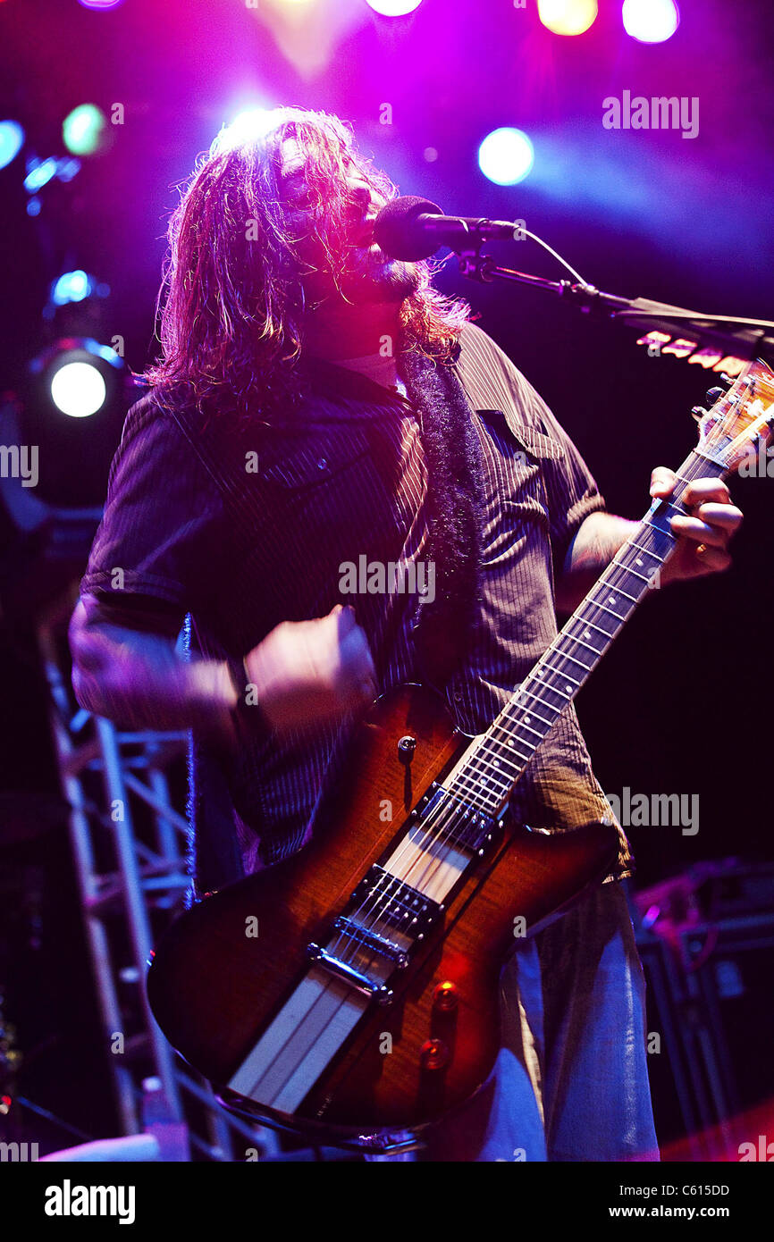 Shaun Morgan Welgemoed of the rock group Seether plays for Marines Sailors and their families during a concert on Marine Corps Base Hawaii. Dec. 17 2010. (BSLOC 2011 12 379) Stock Photo