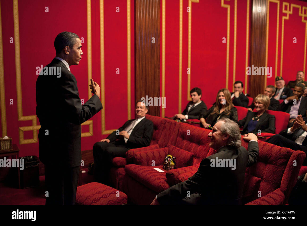President Barack Obama speaks before a screening of the HBO ten-part World War II miniseries 'The Pacific' in the White House Family Theater. Tom Hanks and Steven Spielberg sit in the front row. March 11 2010., Photo by: Everett Collection(BSLOC 2011 7 37) Stock Photo
