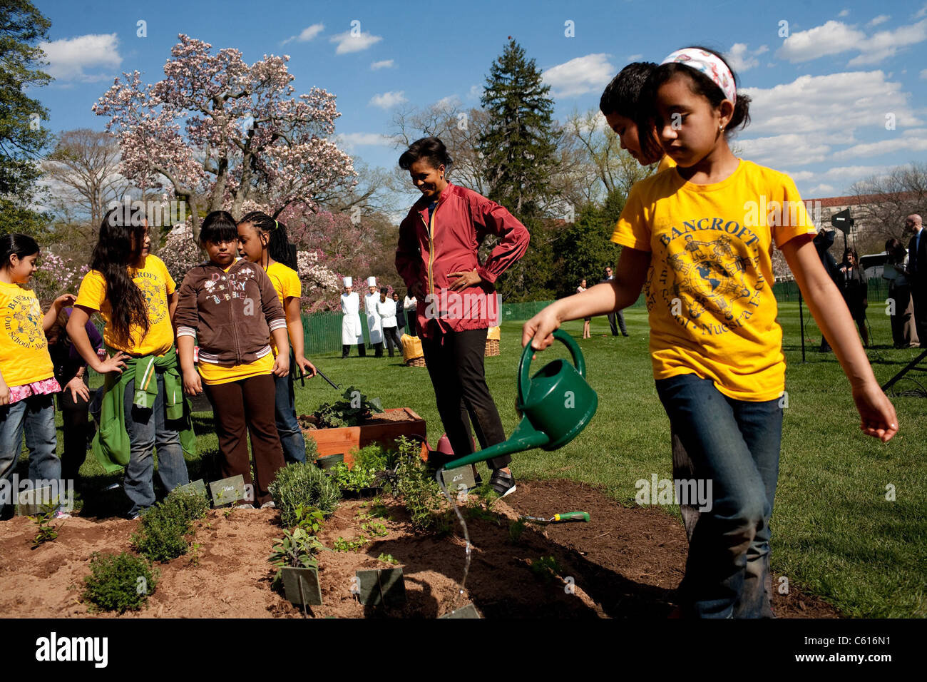 Children from Bancroft Elementary School help First Lady Michelle Obama plant the White House Vegetable Garden April 9 2009., Photo by: Everett Collection(BSLOC 2011 7 74) Stock Photo