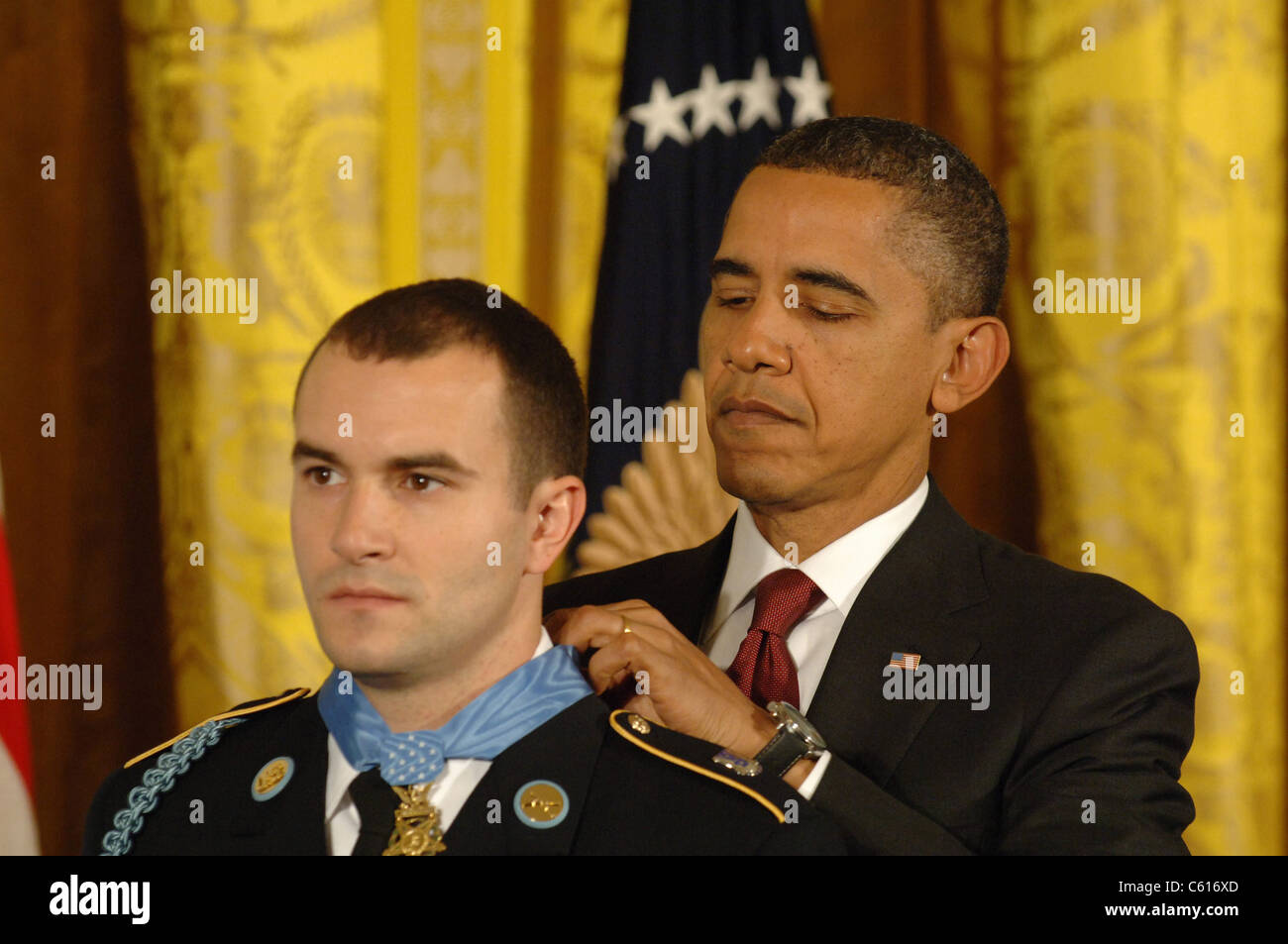 President Obama presents the Medal of Honor to Staff Sergeant Salvatore Giunta for valor and saving the lives of his squad In Afghanistan in 2007. Nov. 16 2010. (BSWH 2011 8 369) Stock Photo
