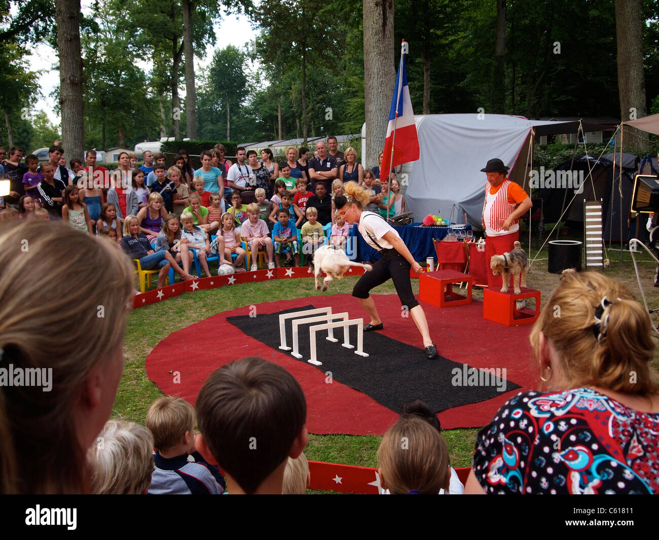 Small travelling circus with dog act performing for tourists on a campsite in Mer, Loire valley, France Stock Photo